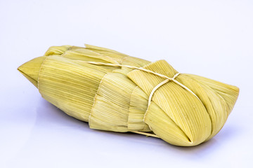 Pamonha. Brazilian Corn Snack on white background