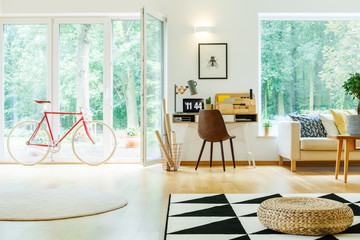 Spacious living room with pouf