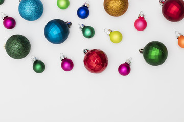 Festive Christmas baubles on a plain white background