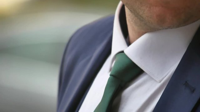 Man tying necktie, close up