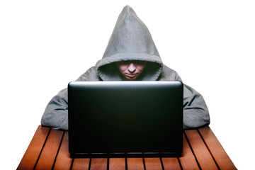 A hacker working on a laptop isolate