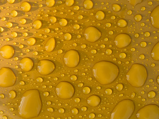 Water Droplets on Yellow Plastic