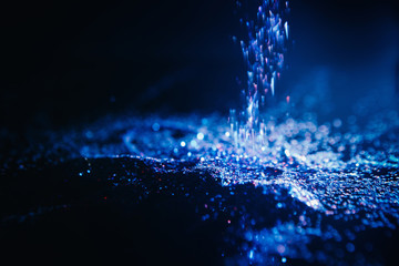 dark blue shimmering glitter background. Crystal glistening waterfall. Nature element concept