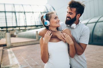 Portrait of young attractive happy fitness couple