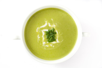 zucchini soup in bowl isolated on white background