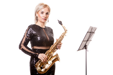 Attractive saxophonist woman playing at her musical instrument. Isolated over white background in...