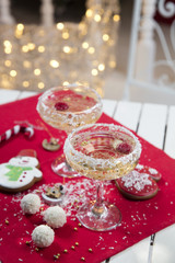 Two champagne glasses on the christmas table