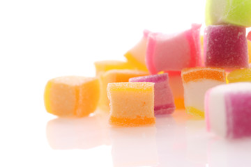 Colorful cube jelly candy isolated in white background