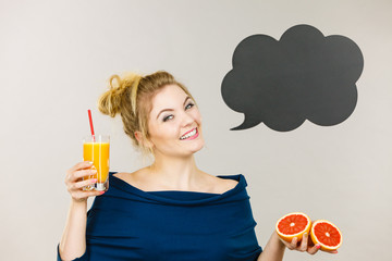 Happy woman holding fresh orange juice