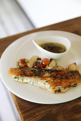 Sea bass fillet on wood background