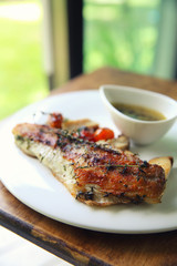 Sea bass fillet on wood background