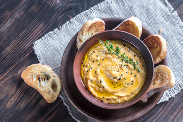 Bowl of pumpkin hummus