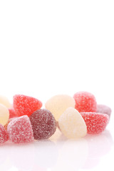 Colorful jelly sugar candies close up isolated in white background