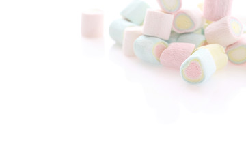 Pastel colourful marshmallows isolated in white background