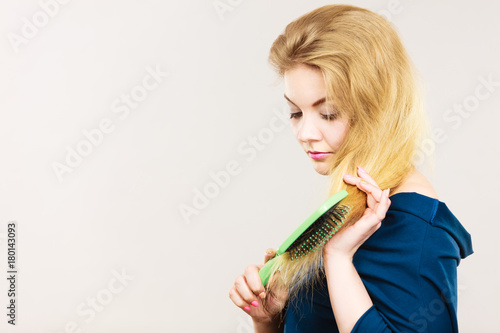 Woman Brushing Her Long Blonde Hair Stock Photo And Royaltyfree