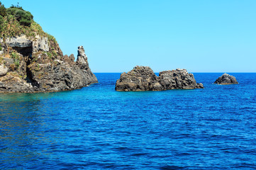 Fototapeta na wymiar Lachea Island on Aci Trezza, Sicily coast