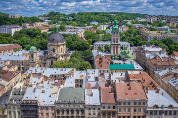 Fototapeta na wymiar Cityscape of Lviv, Ukraine - aerial view from Town Hall tower with former Dominican Church and Dormition Church