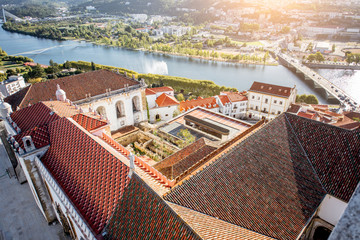 Aerial cityscape view on the old town of Coimbra during the sunset in the central Portugal