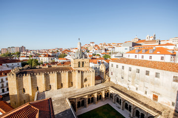 Fototapeta na wymiar Top view on the old cathedral with beautiful courtyard in Coimbra city in the central Portugal