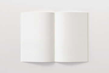 Blank opened Magazine or Brochure isolated on white. Pages top view. Mockup template for your showcase.