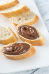 Obraz na płótnie Canvas Slices of baguette with chocolate cream