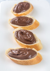 Slices of baguette with chocolate cream