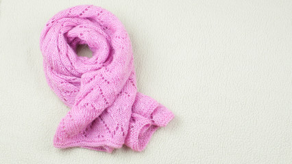 Pink handmade scarf on the white background
