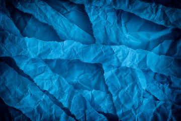 Torn and crumpled blue background