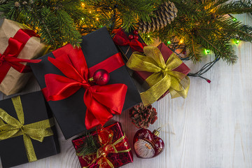 christmas gift boxes near the tree and illumination with copy space