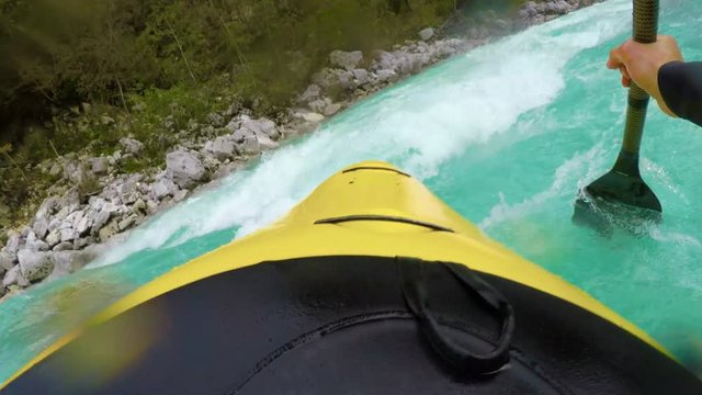 POV of kayaking down the rapids of an amazing blue river white water.