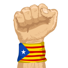 Fist wearing a flag of Catalonia wristband clenched tight