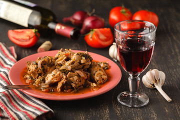 chicken in tomato sauce in a bowl chakhokhbili