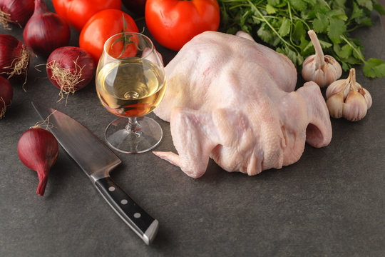 Ingredients for cooking healthy meat dinner. Raw uncooked quail meat with vegetables