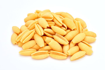 Macaroni on a white background. Products from flour. Varied macaroni. Isolated pasta.