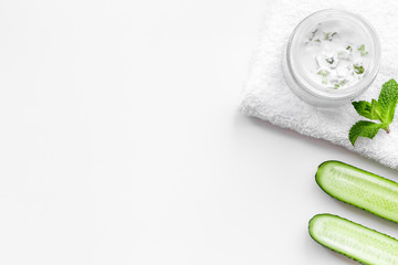 Cucumber moisturising cream or mask. White background top view copyspace