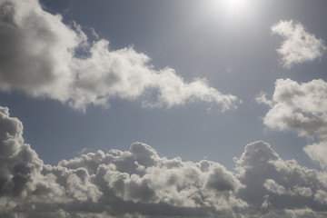Isolated View of White Clouds Against Pale Blue, Sunlit Sky