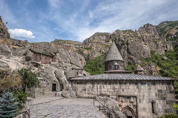 Fototapeta na wymiar Armenia, the monastic complex Geghard. Entrances to the rock churches and the tomb of Proshyan are surrounded by ancient khachkars.