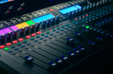 Board mixing console. Mixer. The sound engineer's console. Sound engineer's fingers are pressing the button audio controller.work place sound engineer's.