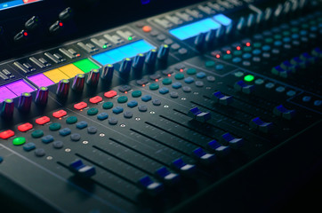 Board mixing console. Mixer. The sound engineer's console. Sound engineer's fingers are pressing...
