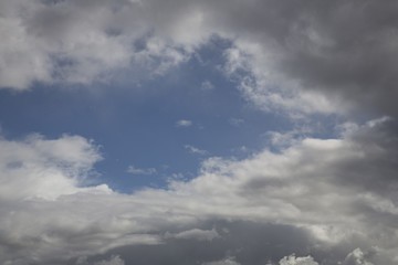 Obraz premium Isolated View of White Clouds Against Blue, Sunlit Sky - Backdrop