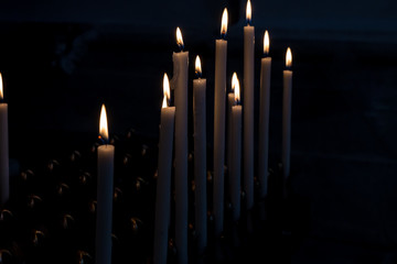 lit candles in the dark