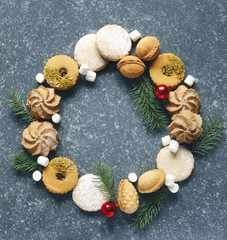 Christmas Cookies wreath. Assorted cookies: linzer cookies,shortbread, nuts cookie, orange almond cookie.