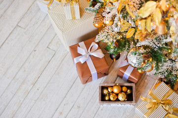 gifts lying on the floor near the Christmas tree