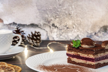 Christmas tiramisu and white cup of tea