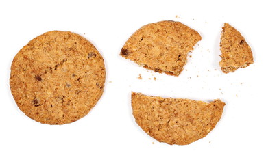 Round broken wholewheat biscuit with chocolate isolated on white background, top view