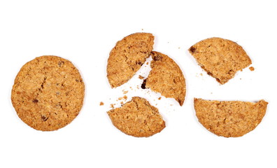 Round broken wholewheat biscuit with chocolate isolated on white background, top view