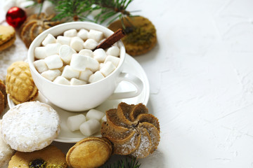 Cup of hot chocolate and assorted cookies: linzer cookies,shortbread, nuts cookie, orange almond cookie.