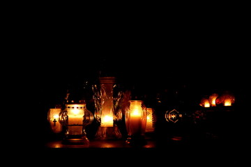 Burning candles in the cemetery on the day we mention dead people.
