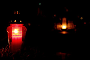 Burning candles in the cemetery on the day we mention dead people.
