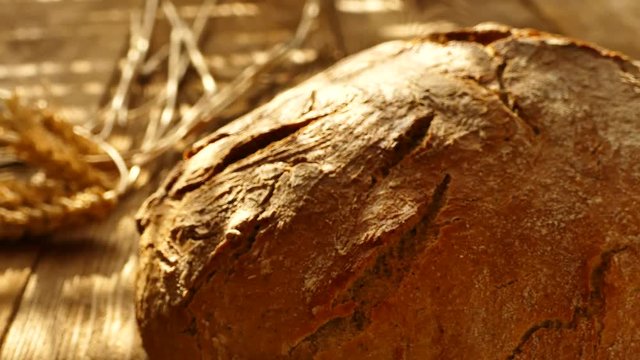 Fresh bread on the table. Bread in the hands.